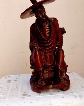 Statua fumatore di oppio