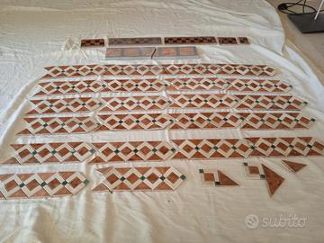 Eleganti intarsi da arredo in marmo