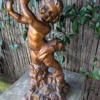 scultura putto in terracotta 