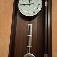 orologio da parete con dondolo