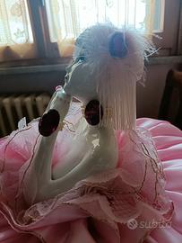 Bambola ceramica letto