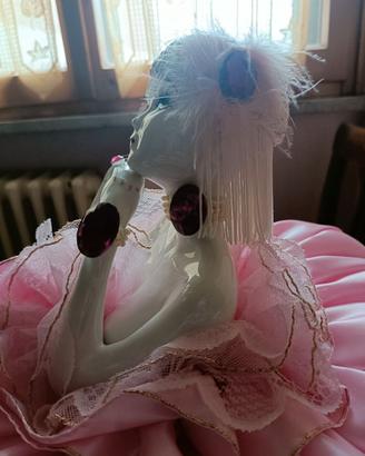 Bambola ceramica letto