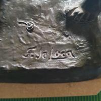 Scultura in lega metallica pettinatura bronzo.