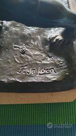 Scultura in lega metallica pettinatura bronzo.