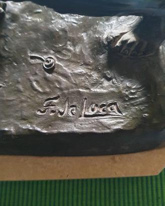 Scultura in lega metallica pettinatura bronzo.