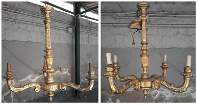Antichi lampadari in legno dorati