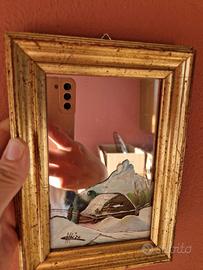 Quadro con immagine dipinta e specchio