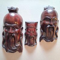 Tre maschere orientali in legno duro