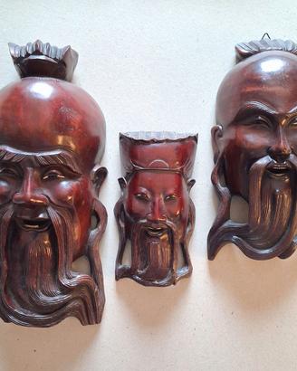 Tre maschere orientali in legno duro