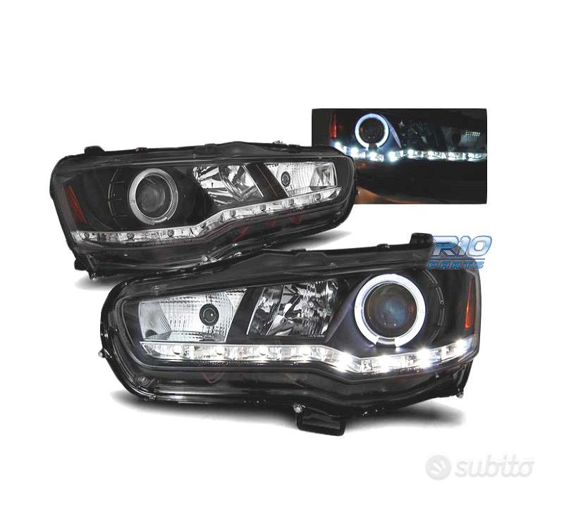 Subito - RICAMBI DIECI - FARI MITSUBISHI LANCER VIII 08- DAYLIGHT NERI ...