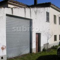 Terreno con fabbricati collabende