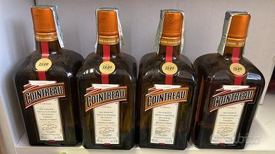 Quattro bottiglie di cointreau