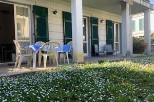 TRILOCALE CON GIARDINO e POSTO AUTO