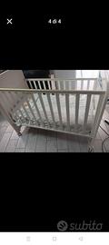 culla con sbarra amovibile in altezza 