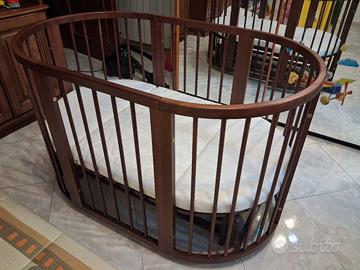 Lettino per bambini con meccanismo a dondolo