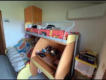 Camera a soppalco tre letti 