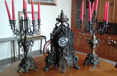 Trittico orologio e candelabri