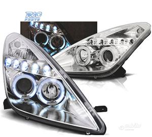 FARI TOYOTA CELICA T23 99-05 LED OCCHI ANGEL CROMA