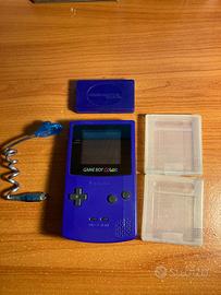 Game Boy Color viola con luce da attaccare + altro
