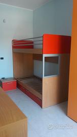 letto a castello con scalini e passatoia