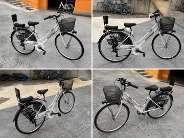 Bici passeggio donna con seggiolino per bambino