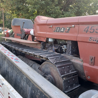 Trattore cingolato con attrezzi