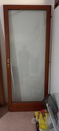 Porta per esterno in legno trattato senza profili