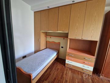 Armadio ponte con letto