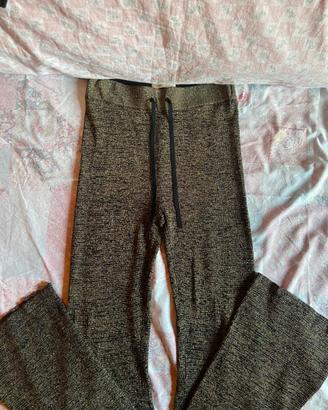 pantaloni a zampa brillantinati oro