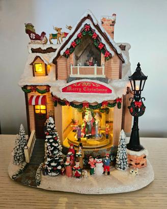 Casetta di Natale con luci, movimento e musica