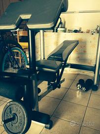 Panca multiuso con bilanciere e pesi