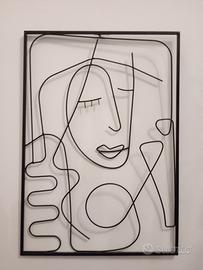 Quadro in metallo con donna