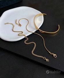 Set con 3 bracciali dorati