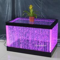 Tavolo con bolle illuminazione multicolore acqua