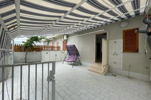 Appartamento piano terra con giardino