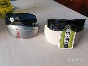 2 paia di occhiali da sole Prada e Bikkembergs 