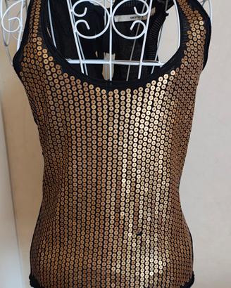 Top marca Gotha. paillettes color oro 