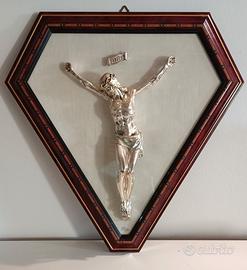 Cristo in argento con cornice triangolare
