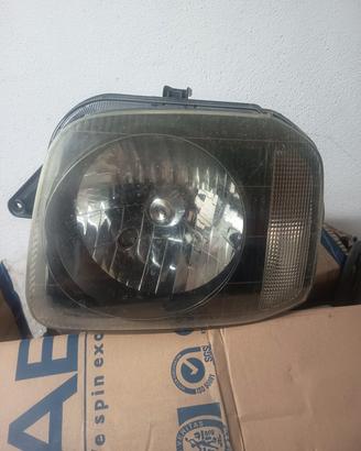 faro anteriore sx Suzuki Jimny 