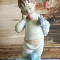 Figurina in porcellana NAO Lladro, bimbo, realizza