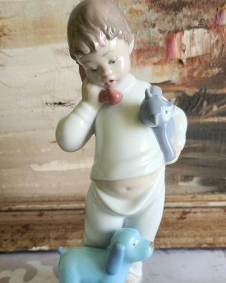 Figurina in porcellana NAO Lladro, bimbo, realizza