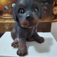 scultura di cucciolo in ceramica