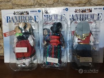 tris bambole di porcellana da collezione