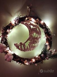 ghirlanda Natale con Natività all'interno.