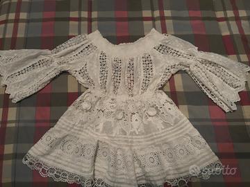Abito bianco pizzo manica a campana