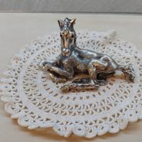 Statuina: cavallo seduto