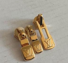 Set tirazip in metallo  dorato Louis Vuitton 
