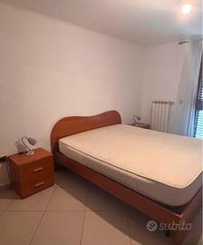 Camera da letto e parete attrezzata