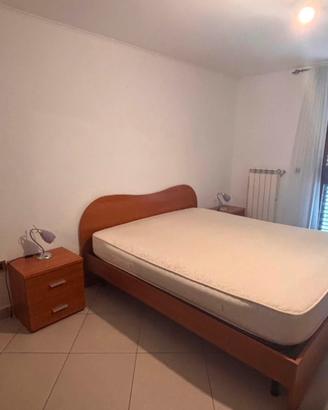 Camera da letto e parete attrezzata