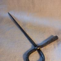 Spannocchiatore in ferro battuto.